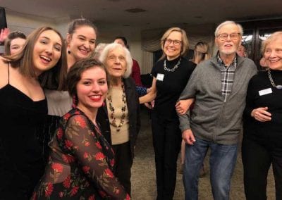 Seniors socialize with college students at Newton, MA's senior living community Lasell Village.