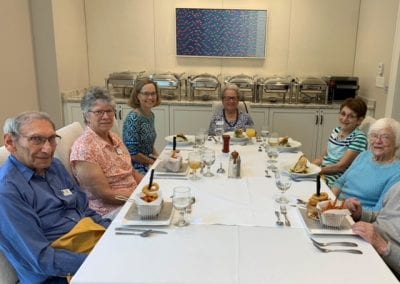 Happy diners enjoy luxury cuisine at top Massachusetts independent living community Lasell Village.